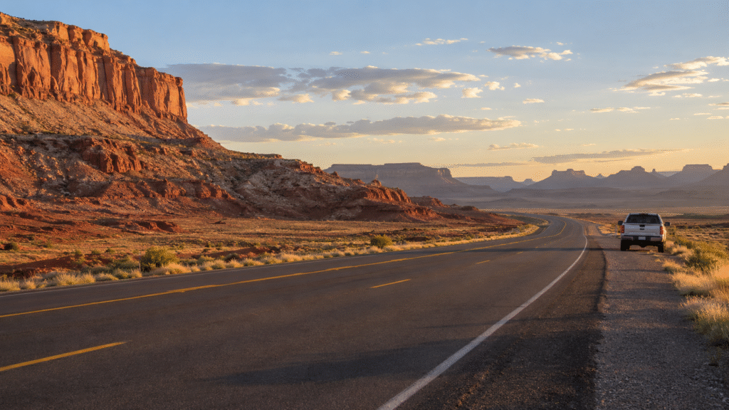 exec-01560a4c-2195-402f-bb79-04ca42963d12 Vehicle stopped on a desert highway in the Navajo Nation
